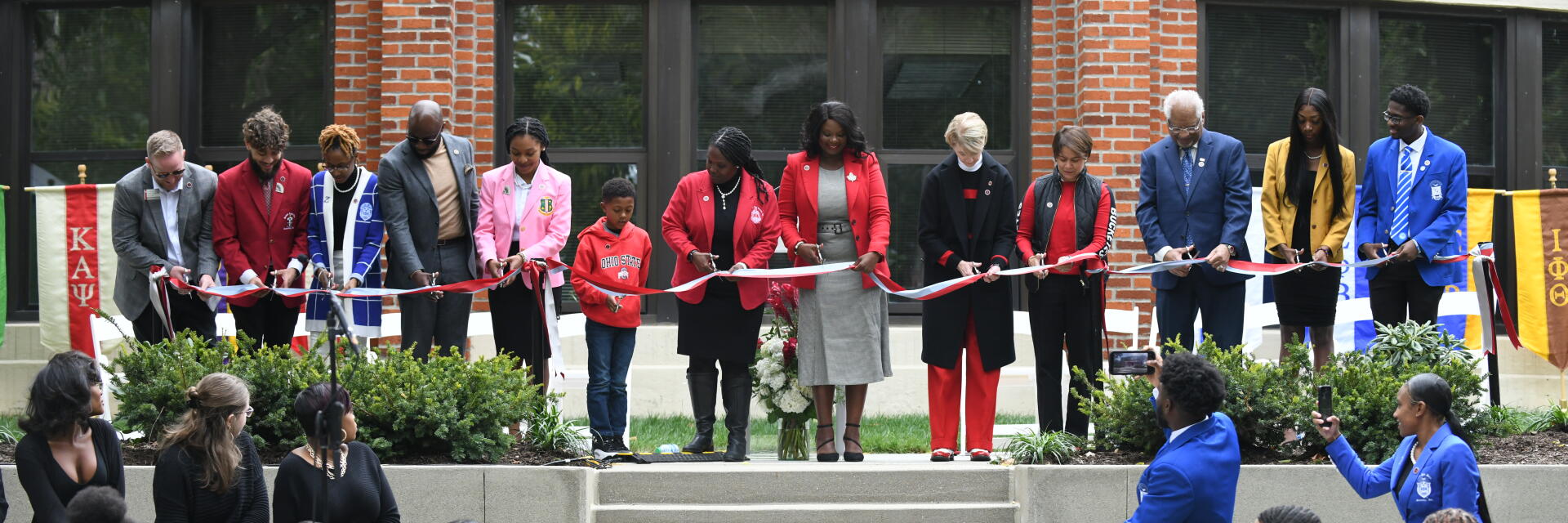 members of student life and NPHC cut the ribbon to unveil the NPHC Plaza